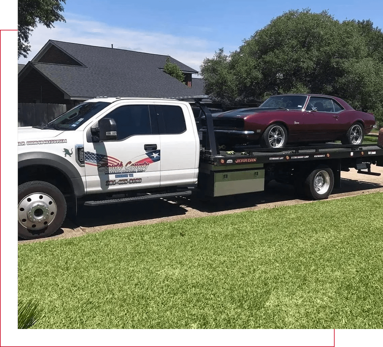 Tow truck carrying a classic car