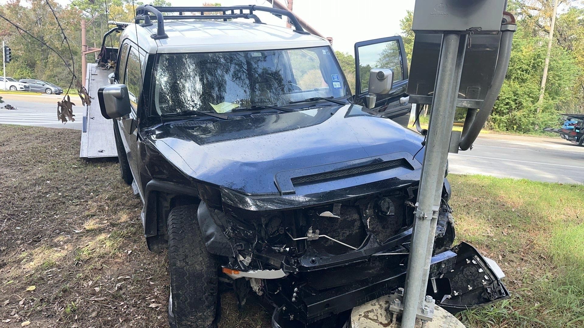 Damaged SUV crashed into a pole