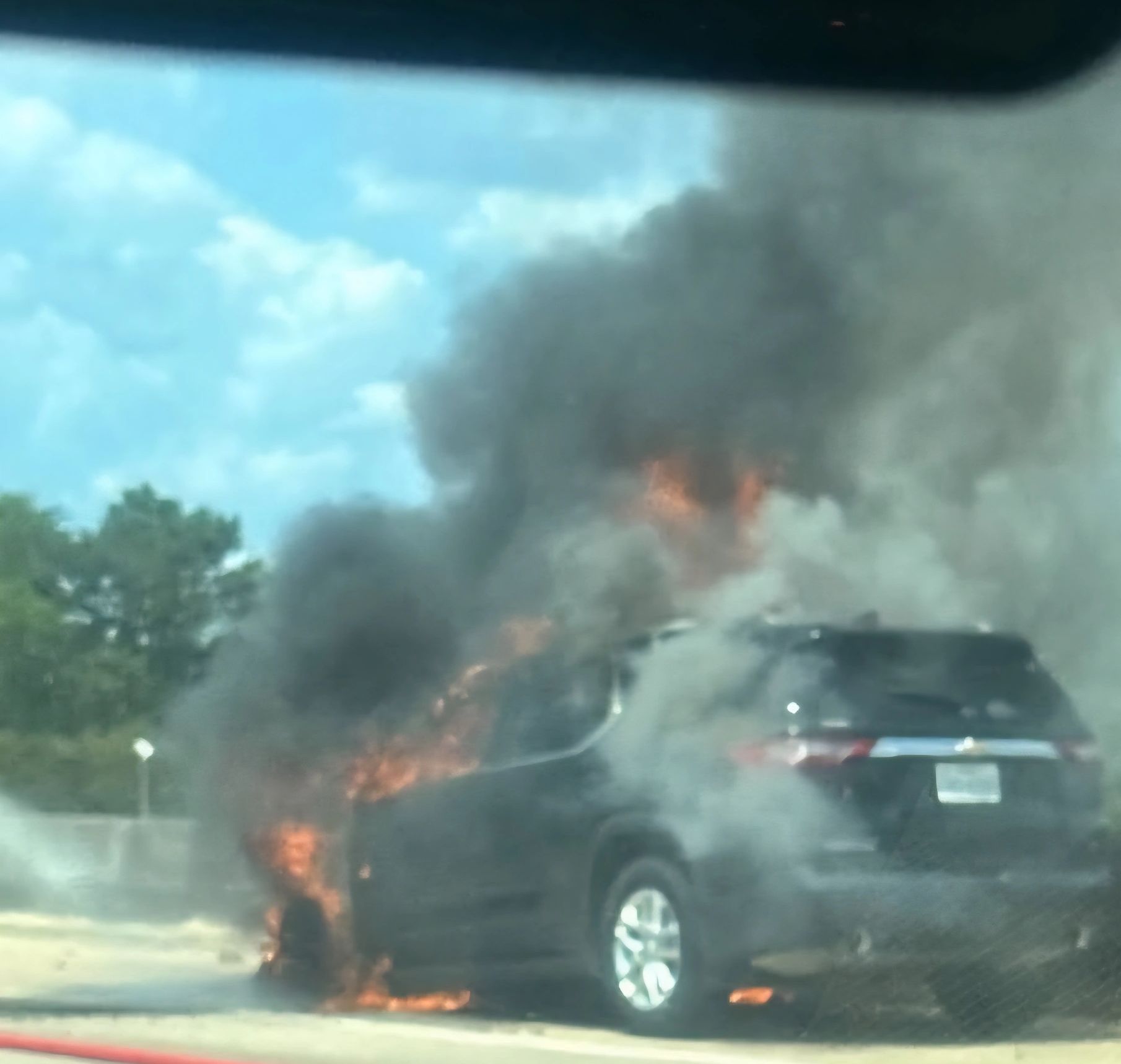 Car engulfed in flames on highway